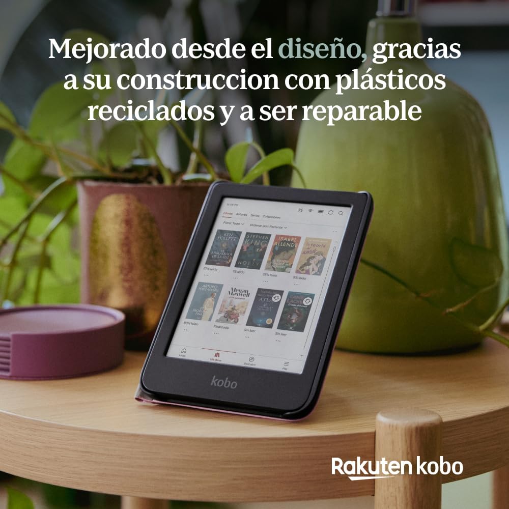 Kobo Clara Colour de pie en su funda sobre una mesa con plantas