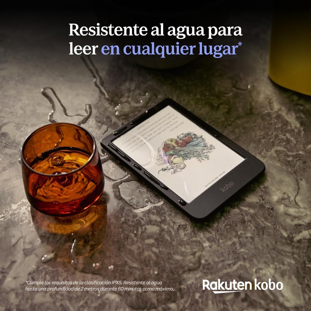 Kobo Clara Colour mojado sobre una mesa junto a un vaso volcado